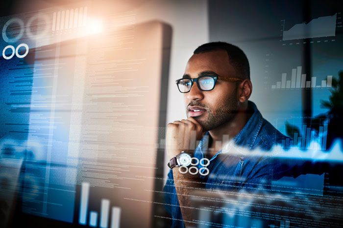 A business owner reviews real-time data analytics from their company fleet fuel card.