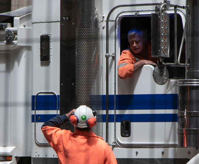 Truck drivers prepare for heading out on their routes.