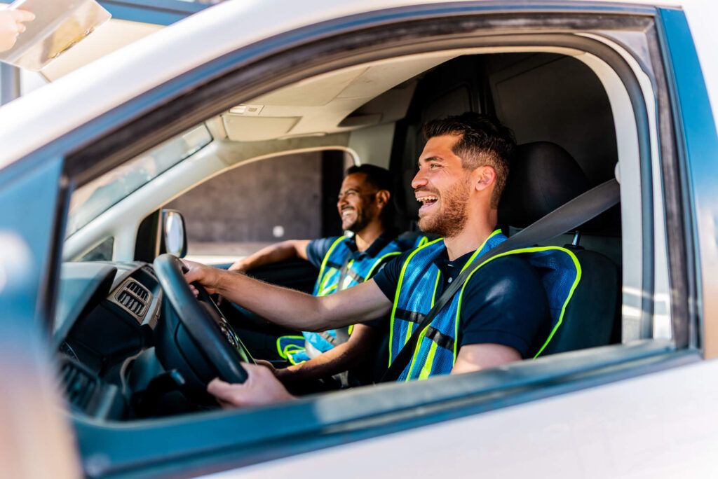Fleet drivers headed out in their van to go to their next job.