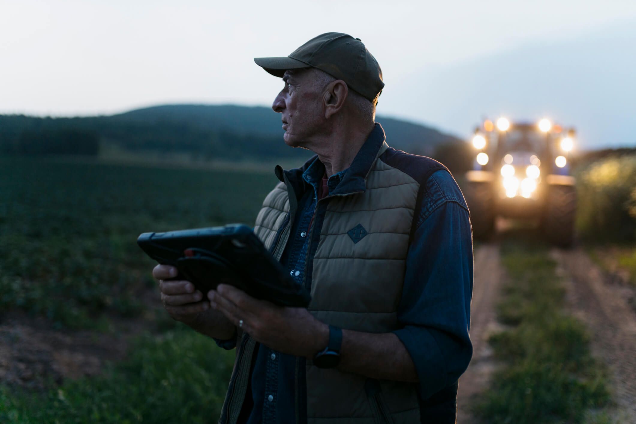 A fleet owner reviews data from his drivers’ fuel card usage on his tablet.